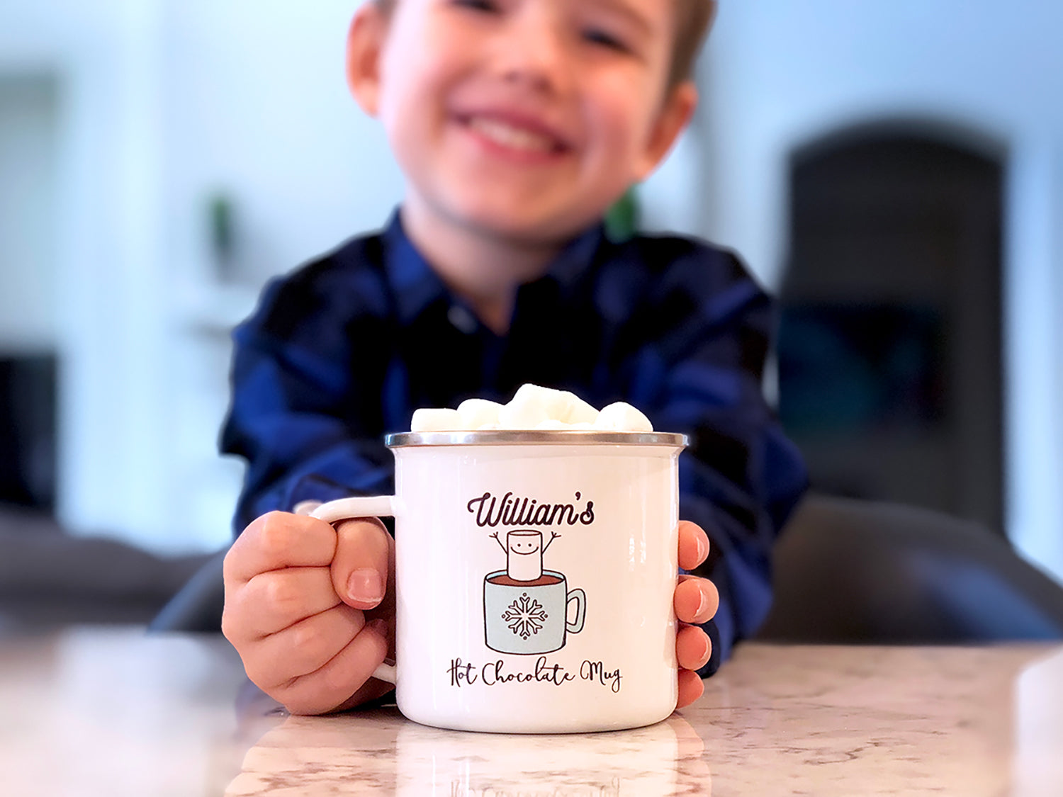 Boy with hot chocolate mug with marshmallows. Mug says "William's Hot Chocolate Mug"